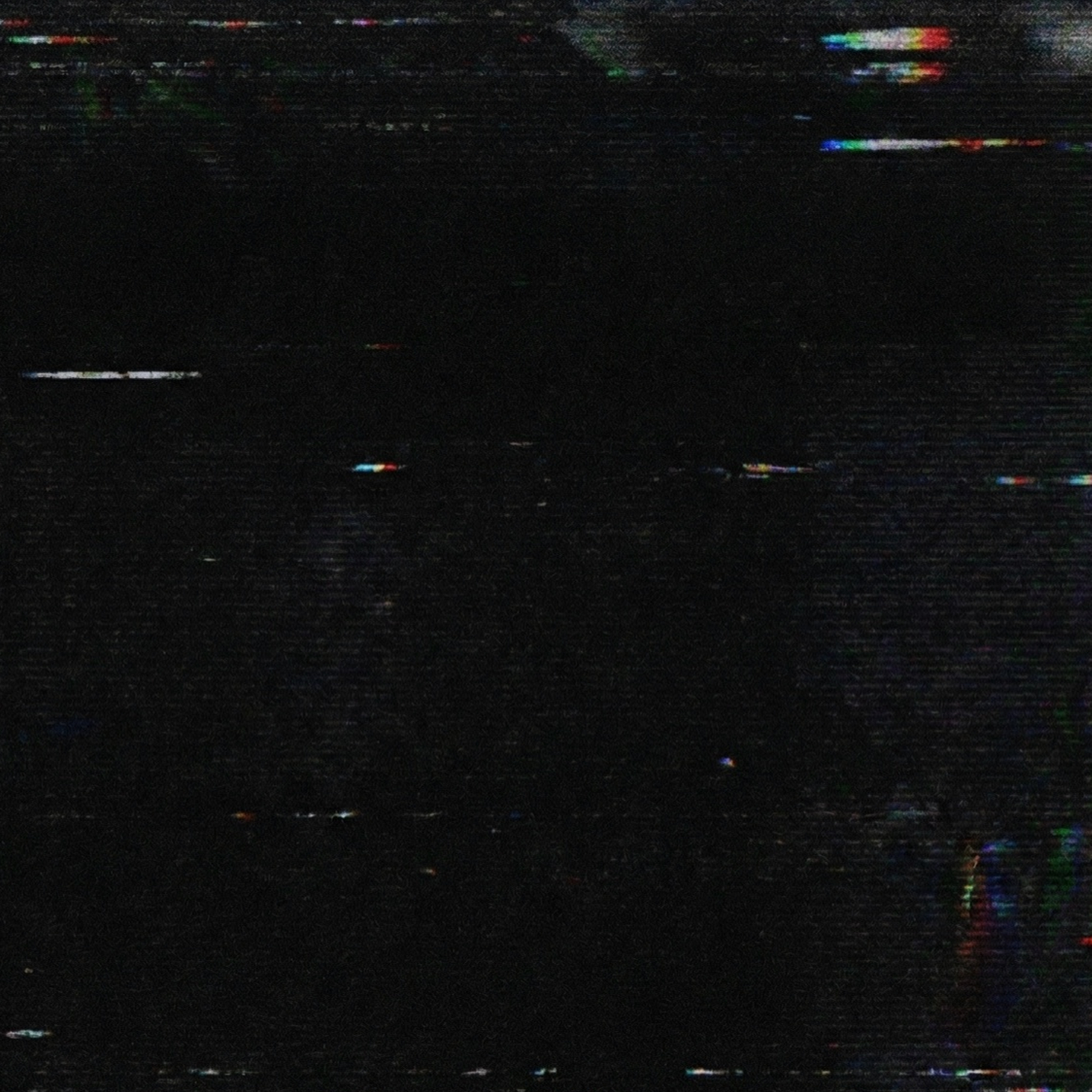Digital noise with multicolor artifacts on a black background